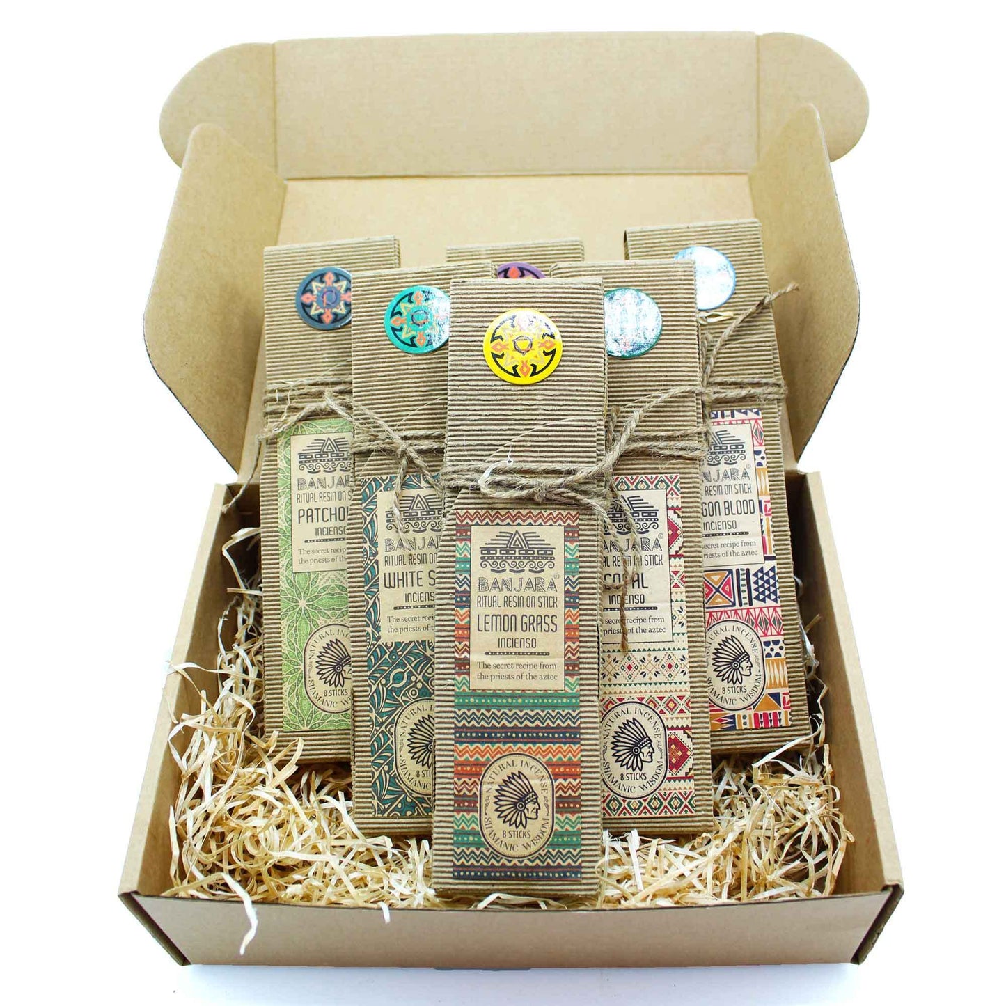 Box of soap bars with colorful labels on a white background