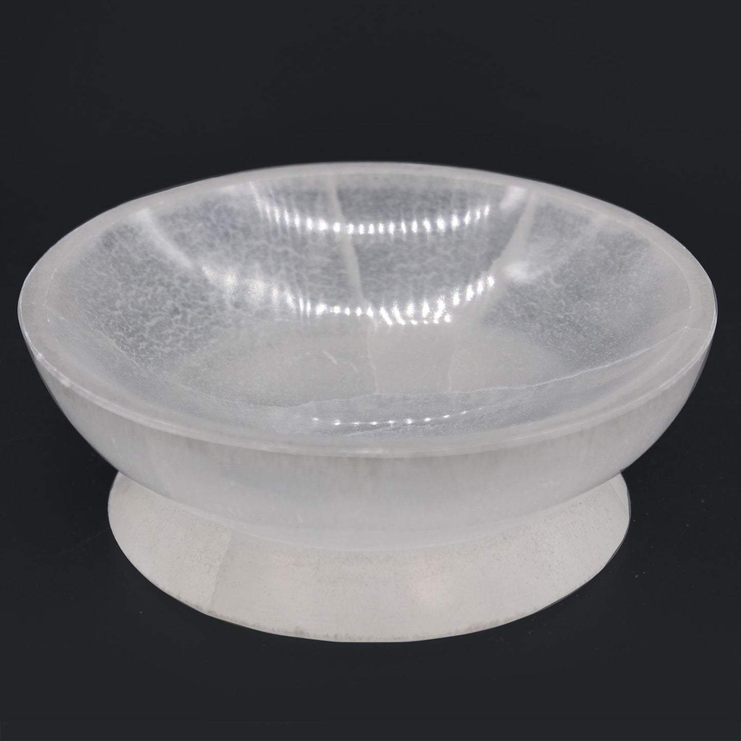 Clear plastic bowl on a black background
