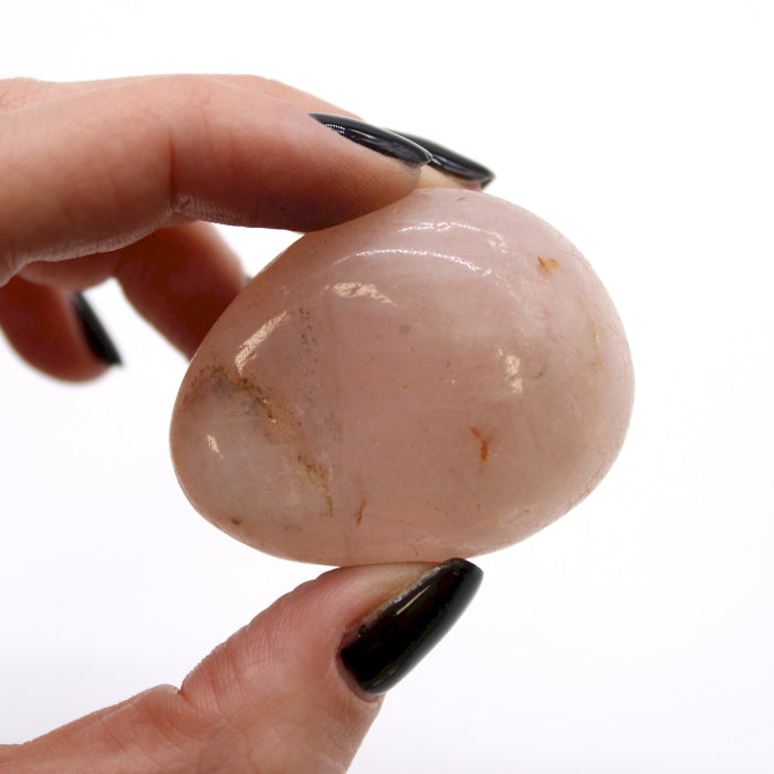 A bag of 6 large natural African Rose Quartz tumbled stones, perfect for healing, meditation, and chakra balancing.