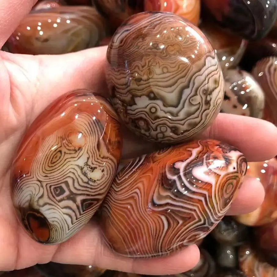 Close-up of Natural Irregular Smooth Agate Stone Healing Crystal showcasing its polished surface and unique patterns.