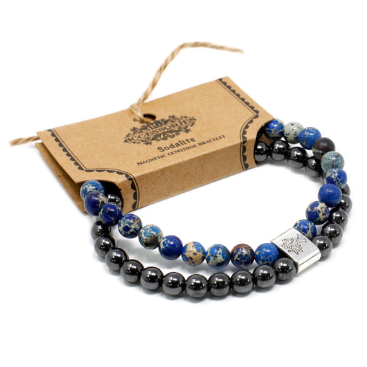 Black and blue beaded bracelet with a silver clasp on a white background