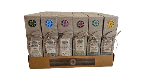 Packaged items with decorative labels on a cardboard display