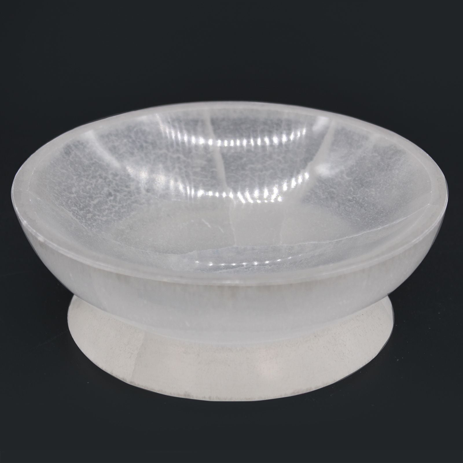 Clear plastic bowl on a black background